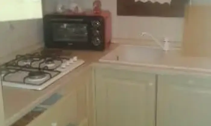 Rexer-Loiri-Porto-San-Paolo-Bilocale-con-piscina-CUCINA
