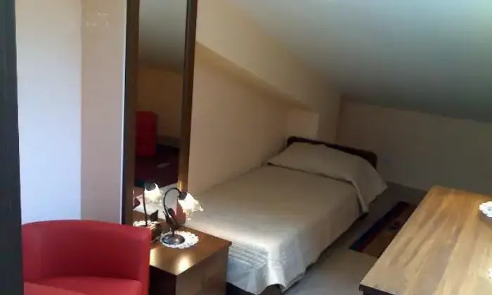 Rexer-Monreale-Mansarda-arredata-CAMERA-DA-LETTO