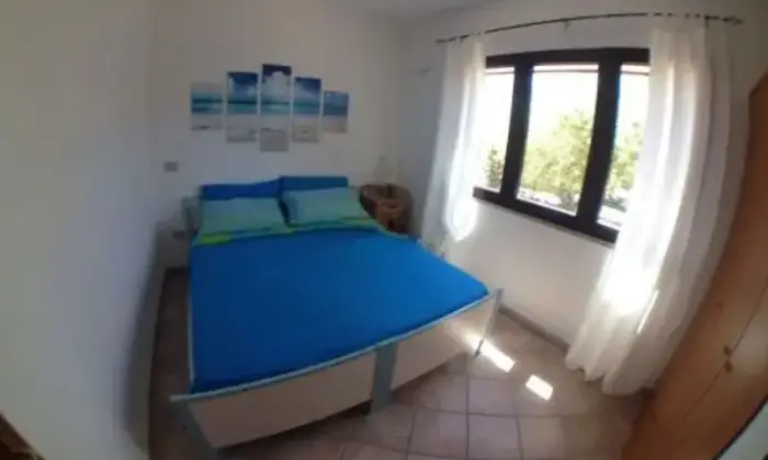 Rexer-San-Teodoro-Elegante-bilocale-vista-mare-CAMERA-DA-LETTO