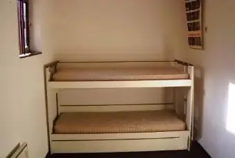 Rexer-Oltre-il-Colle-Ampio-monolocale-CAMERA-DA-LETTO