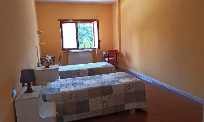 Rexer-LAquila-Ampio-quadrilocale-in-zona-servitissima-CAMERA-DA-LETTO