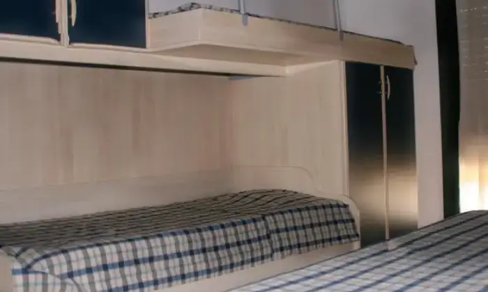 Rexer-Villasimius-Accogliente-trilocale-su-due-livelli-vicino-al-centro-CAMERA-DA-LETTO