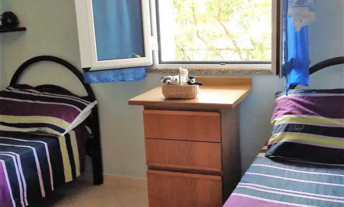 Rexer-Villasimius-Accogliente-Appartamento-vacanza-a-Villasimius-CAMERA-DA-LETTO