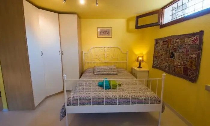 Rexer-SaintPierre-Luminosa-mansarda-mq-a-SaintPierre-CAMERA-DA-LETTO