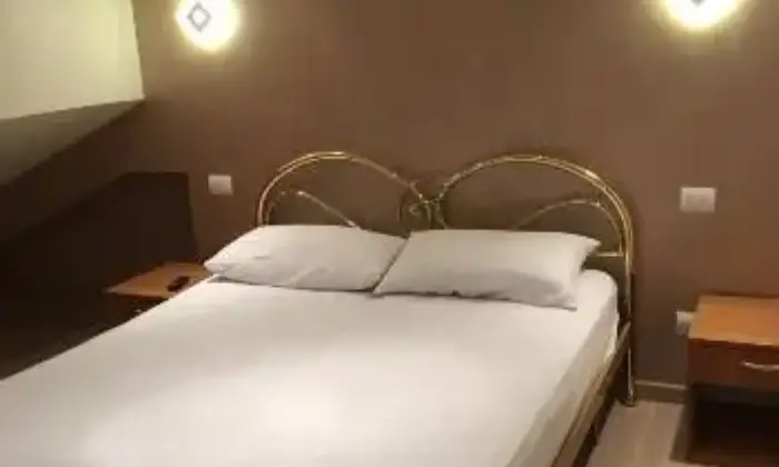 Rexer-LAquila-Mansarda-bilocale-arredata-santa-barbara-CAMERA-DA-LETTO