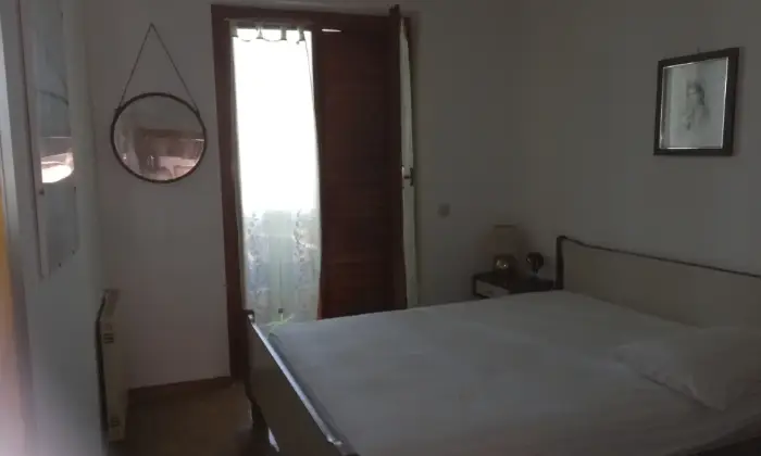 Rexer-Ladispoli-Residence-con-piscina-CAMERA-DA-LETTO