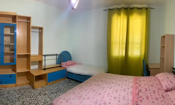 Rexer-Cagliari-Camera-doppia-uso-singola-in-appartamento-CAMERA-DA-LETTO