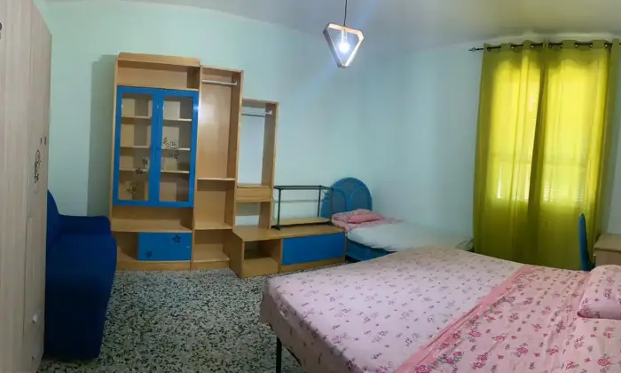 Rexer-Cagliari-Camera-doppia-uso-singola-in-appartamento-CAMERA-DA-LETTO
