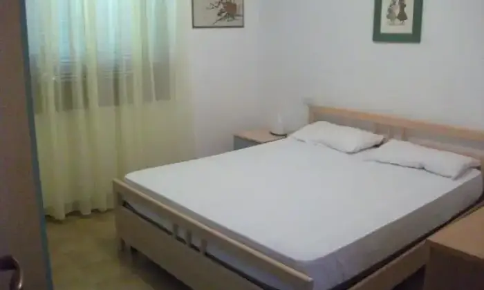 Rexer-Golfo-Aranci-Trilocale-in-residence-CAMERA-DA-LETTO