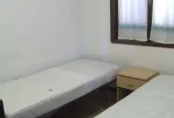 Rexer-Golfo-Aranci-Trilocale-in-residence-CAMERA-DA-LETTO
