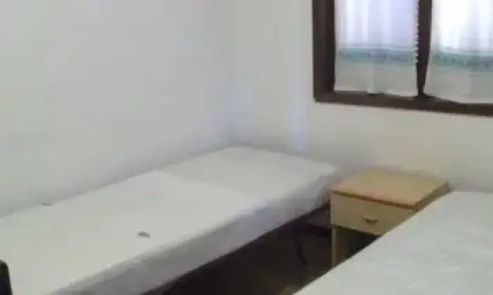 Rexer-Golfo-Aranci-Trilocale-in-residence-CAMERA-DA-LETTO