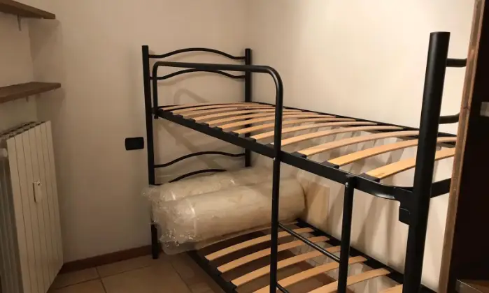 Rexer-Tem-Affittasi-monolocale-a-Villa-Dalegno-CAMERA-DA-LETTO