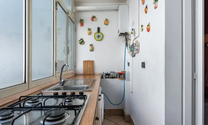 Rexer-Catania-Luminoso-appartamento-al-piano-con-ascensore-e-CON-VISTA-MARE-CUCINA