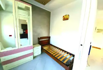 Rexer-Palermo-APPARTAMENTO-mq-immerso-nel-verde-CameraDaLetto