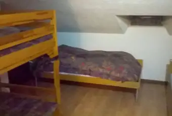 Rexer-Ardesio-Vendesi-appartamento-in-via-Val-las-Ardesio-CameraDaLetto