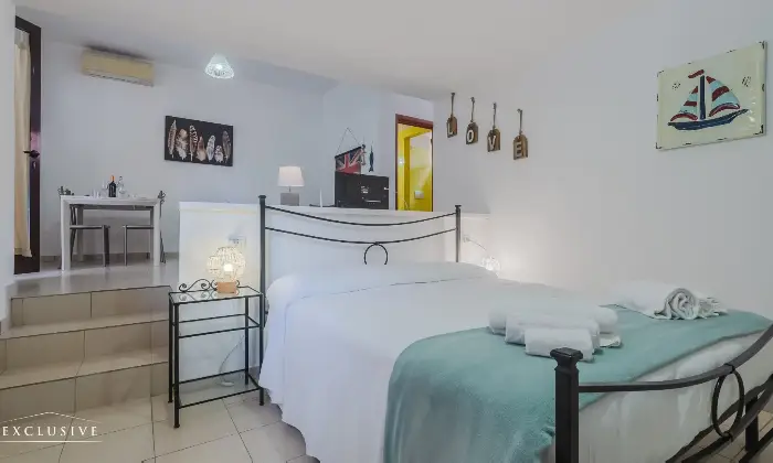 Rexer-CAPOLIVERI-Residence-costituito-da-unit-immobiliari-con-spazi-esterni-parcheggio-e-zone-comuni-CameraDaLetto