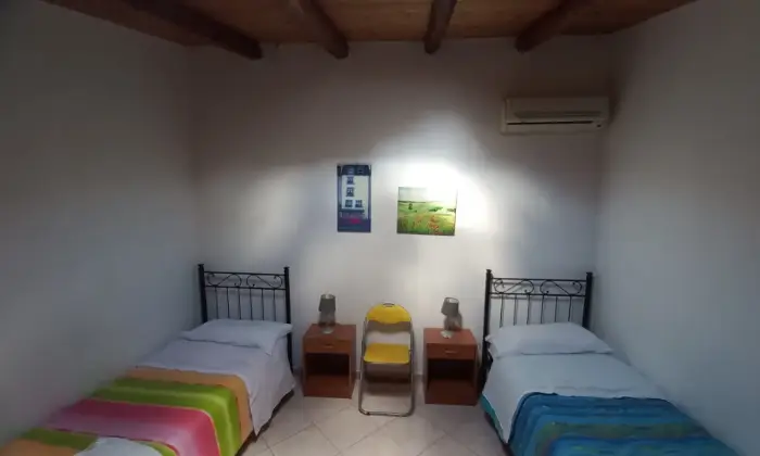 Rexer-Vittoria-Villa-con-grande-appartamento-climatizzato-CameraDaLetto