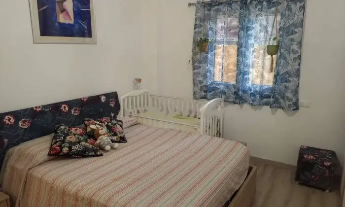 Rexer-Roma-Appartamento-in-vendita-in-via-Umberto-Grosso-a-Ostia-Ponente-Roma-CameraDaLetto