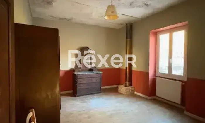 Rexer-Montaldeo-Tenuta-con-casa-padronale-appartamenti-indipendenti-e-ettari-di-terreno-ideale-per-agriturismo-o-residenza-privata-Camera-da-letto