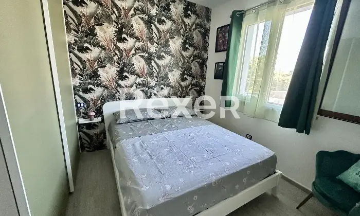 Rexer-Budoni-Casa-con-finiture-di-pregio-e-piscina-mt-dalla-spiaggia-CameraDaLetto