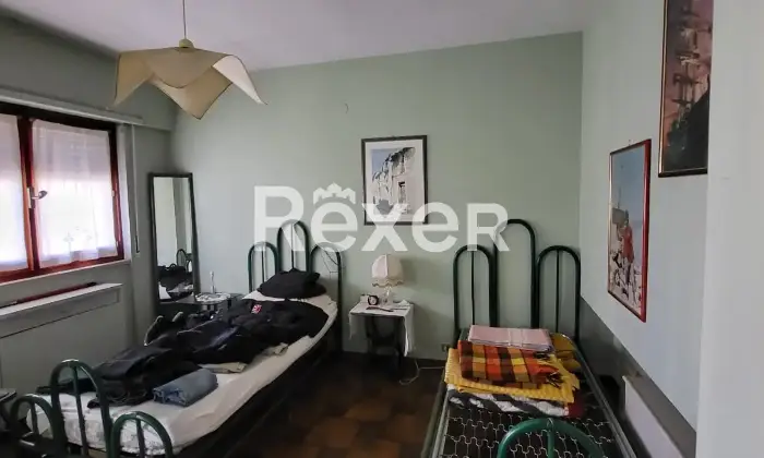 Rexer-Nuoro-Appartamento-Via-Lombardia-angolo-Via-Veneto-sito-al-piano-Camera-da-letto