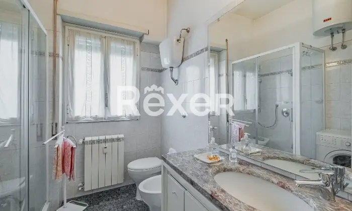 Rexer-Roma-trilocale-piano-alto-con-box-auto-Altro