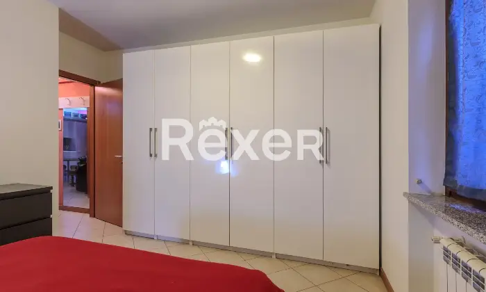Rexer-Capriate-San-Gervasio-Ampio-bilocale-con-balcone-e-garage-Camera-da-letto-matrimoniale