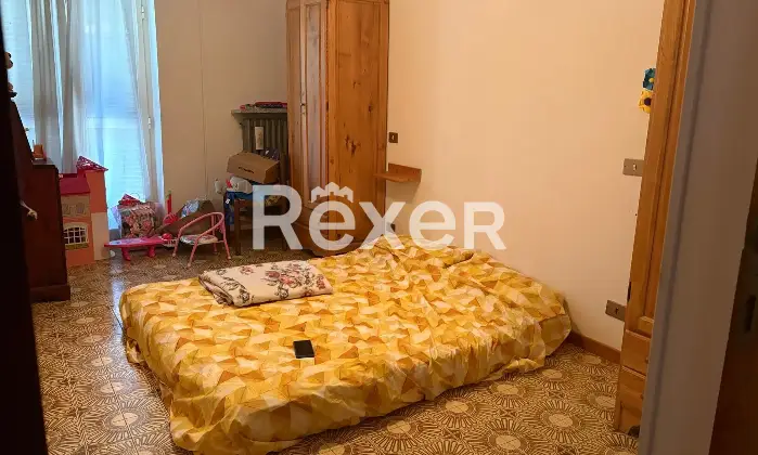 Rexer-Tagliacozzo-Spazioso-appartamento-CameraDaLetto