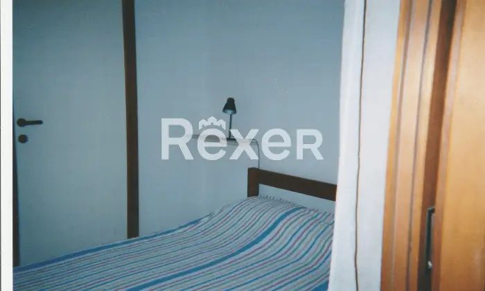 Rexer-Olbia-Bilocale-di-mq-a-Portisco-Camera-da-letto-matrimoniale