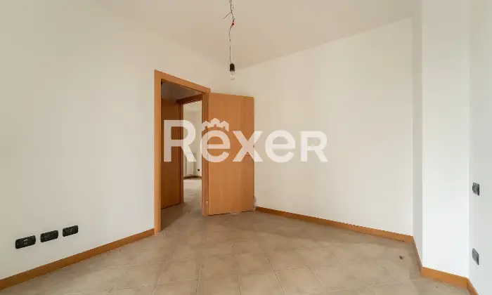 Rexer-Milano-Bilocale-in-torre-Fra-Pampuri-Camera-da-letto-matrimoniale