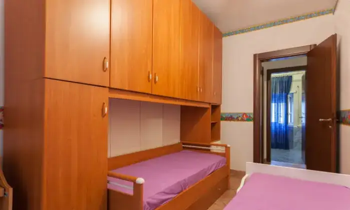 Rexer-Fiumicino-Appartament-Passoscuro-Bambin-Ges-CAMERA-DA-LETTO