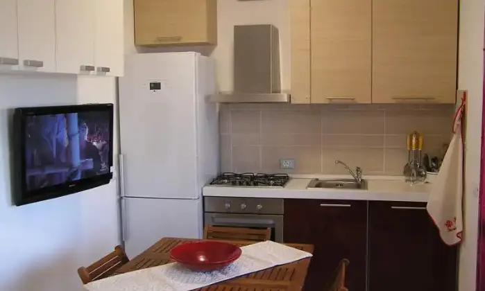 Rexer-Stintino-Appartamento-in-magnifico-scenario-con-terrazzo-con-vista-mare-CUCINA