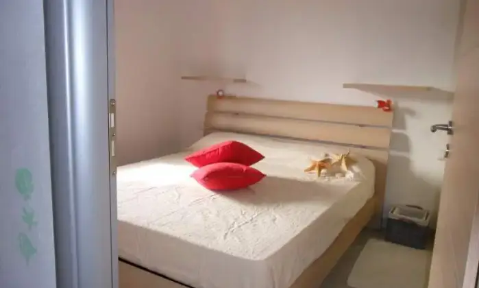 Rexer-Stintino-Appartamento-in-magnifico-scenario-con-terrazzo-con-vista-mare-CAMERA-DA-LETTO