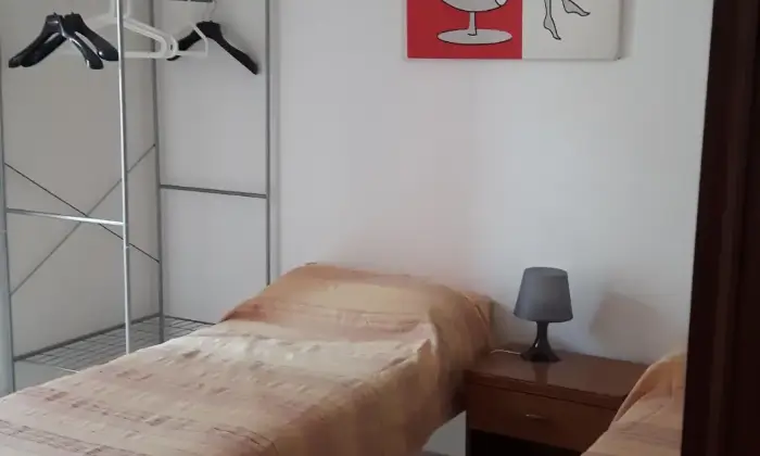 Rexer-Catania-Appartamenti-villaggio-cielo-azzurro-vicini-alla-spiaggia-CAMERA-DA-LETTO