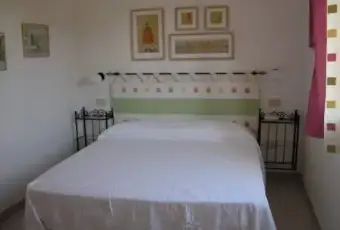 Rexer-Porto-Coda-Cavallo-Grazioso-bilocale-sul-mare-CAMERA-DA-LETTO