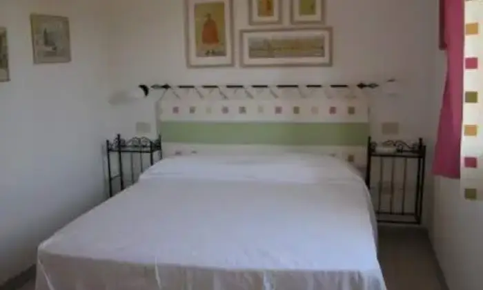 Rexer-Porto-Coda-Cavallo-Grazioso-bilocale-sul-mare-CAMERA-DA-LETTO