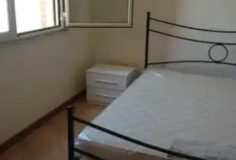 Rexer-Nettuno-Luminoso-bilocale-vista-mare-CAMERA-DA-LETTO