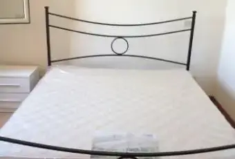 Rexer-Nettuno-Luminoso-bilocale-vista-mare-CAMERA-DA-LETTO
