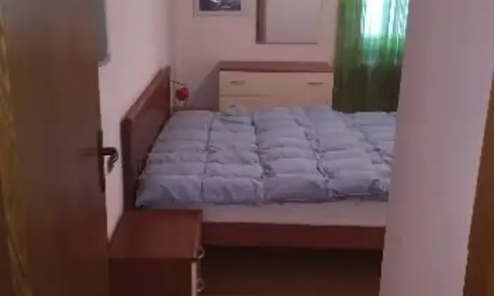 Rexer-Madesimo-Pratico-bilocale-CAMERA-DA-LETTO